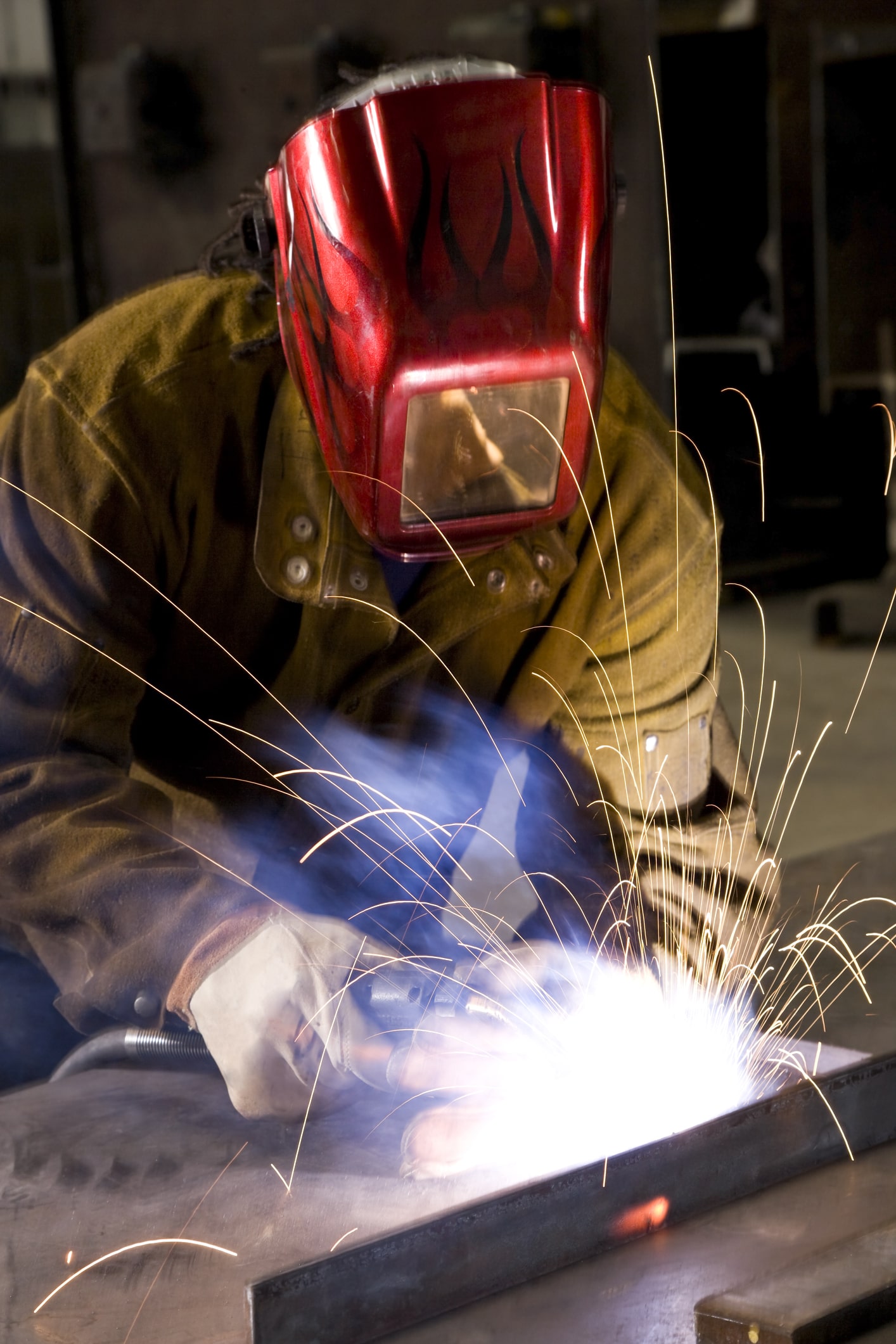 African American industrial worker welding